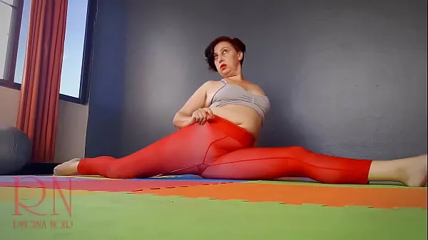 مقاطع علوية Regina Noir. A woman in yoga leotards practices yoga in the gym. Transparent red leotard yoga. Pantyhose C1 جديدة